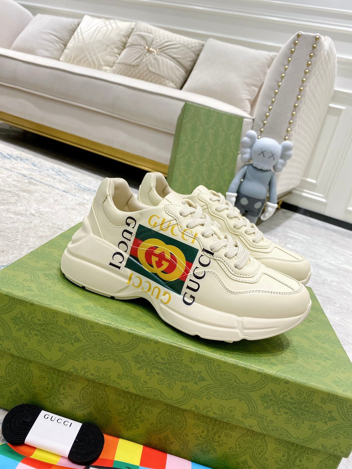 Gucci unisex leather sneakers, white with lace-up design and GG logo detail.
