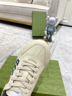 Gucci unisex sneakers, cream uppers with side GG detail and lace-up front