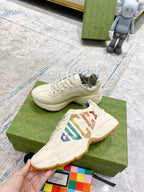 Gucci unisex sneakers, cream uppers with multicolor GG stripe logo and laces