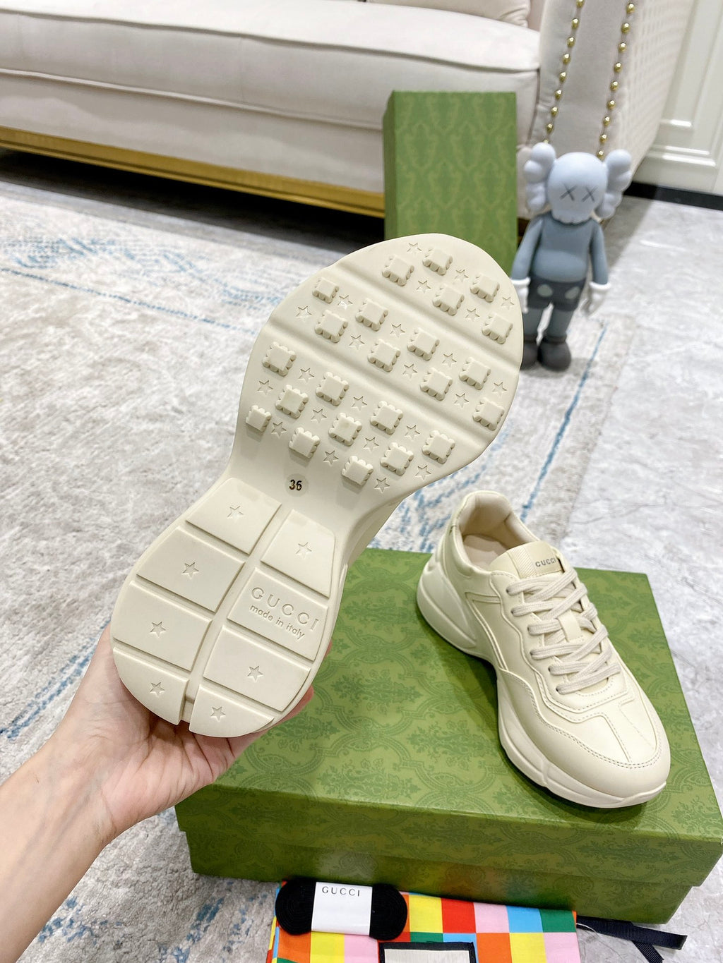 Cream Gucci sneakers outsole view, textured tread on rubber sole
