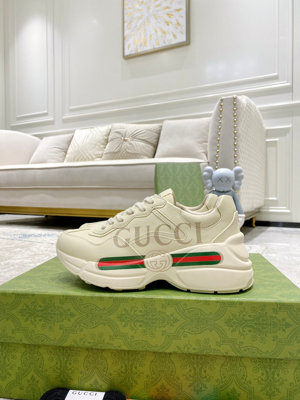Unisex cream Gucci sneakers with green red stripe, cushioned sole and lace-up