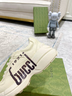 Gucci unisex sneakers in cream leather-look, GUCCI 1921 side stripe and lace-up upper