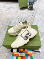 Gucci unisex sneakers in cream, lace-up with GUCCI 1921 stripe and stitched panel detailing