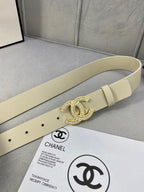 Beige leather belt with large Chanel CC rhinestone buckle and punched holes