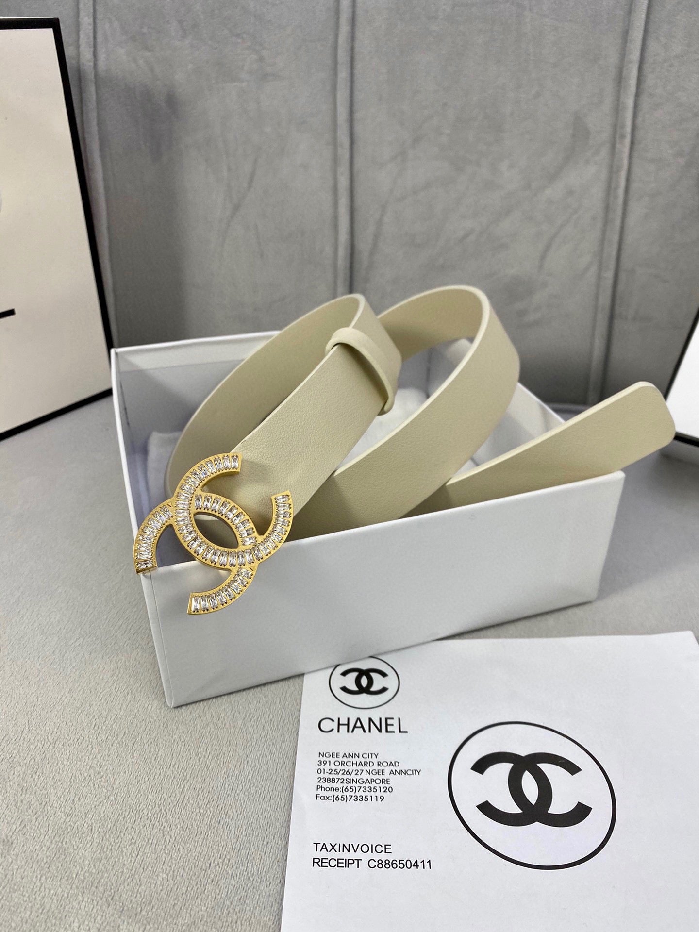 Beige leather belt with Chanel CC rhinestone buckle in a white gift box