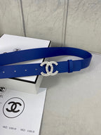 Blue leather belt with rhinestone CC logo buckle and adjustable holes, side view