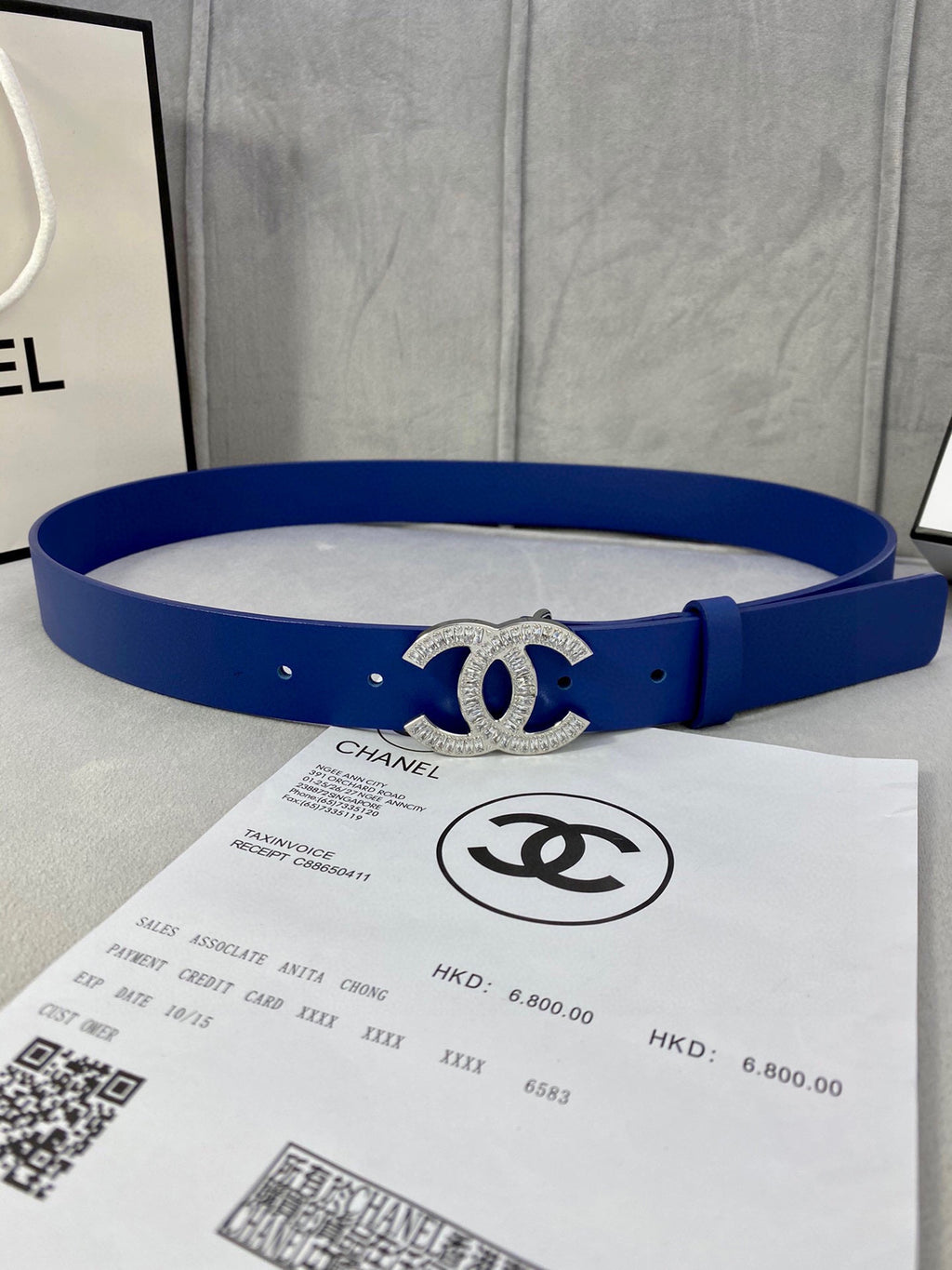 Blue leather belt with silver-tone rhinestone CC buckle and round hole detailing