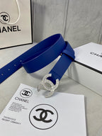 Blue leather belt with rhinestone CC buckle, loop through strap and stud holes