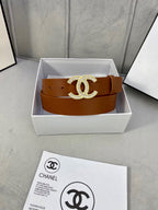 Brown leather Chanel belt with gold-tone rhinestone CC buckle in a white gift box