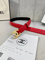 Chanel belt on red leather strap with gold circular CHANEL buckle and perforated holes.