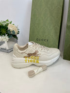 Gucci unisex sneakers in cream leather with tiger graphic and yellow GUCCI TIGER logo
