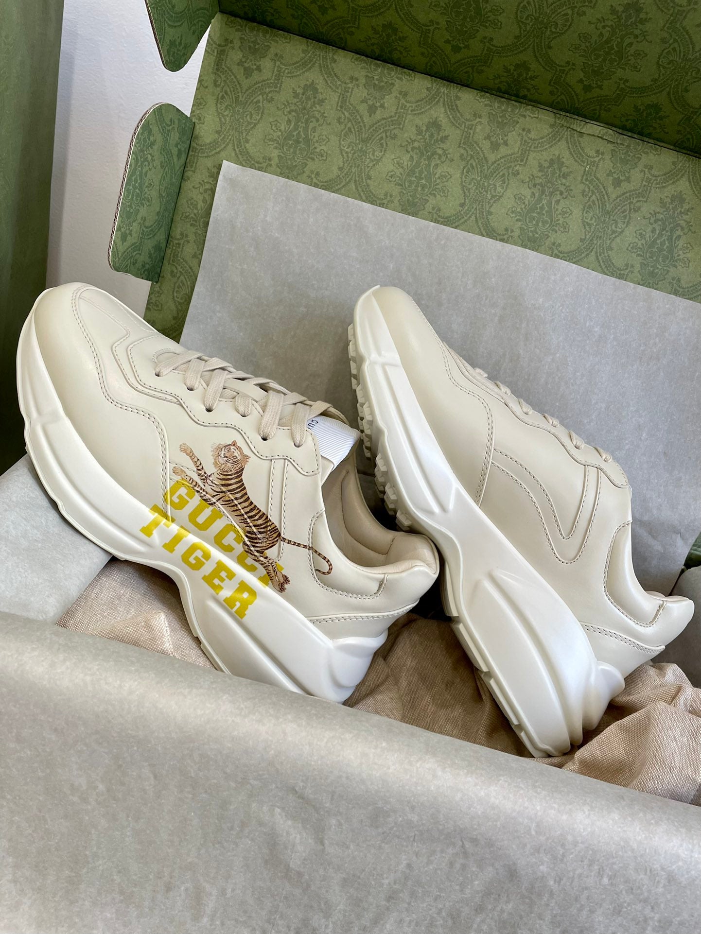 Gucci unisex sneakers, cream leather uppers with tiger logo and yellow GUCCI TIGER text