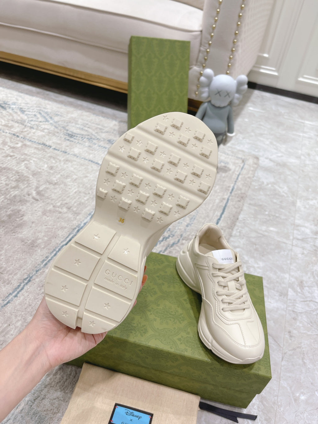 Gucci unisex white luxury sneakers outsole view with textured tread and brand mark
