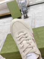 Gucci unisex white luxury sneakers close-up of toe and laces with side logo detail
