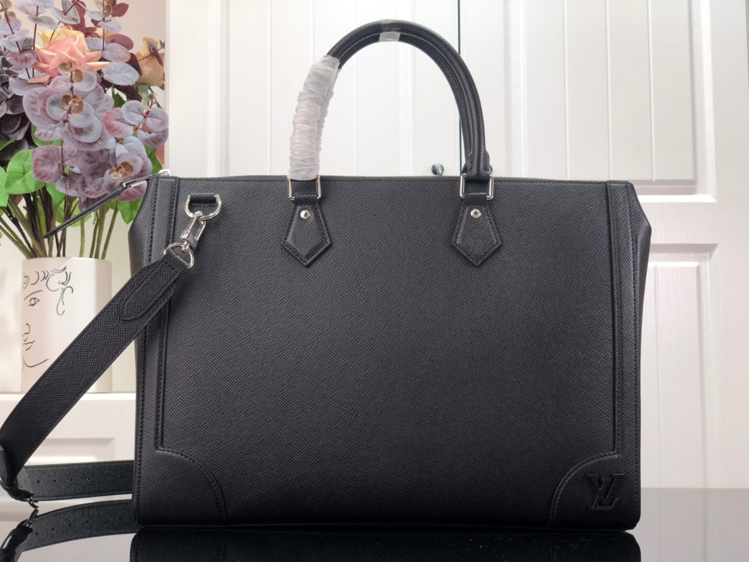 Louis Vuitton black leather handbag with top handles and side details