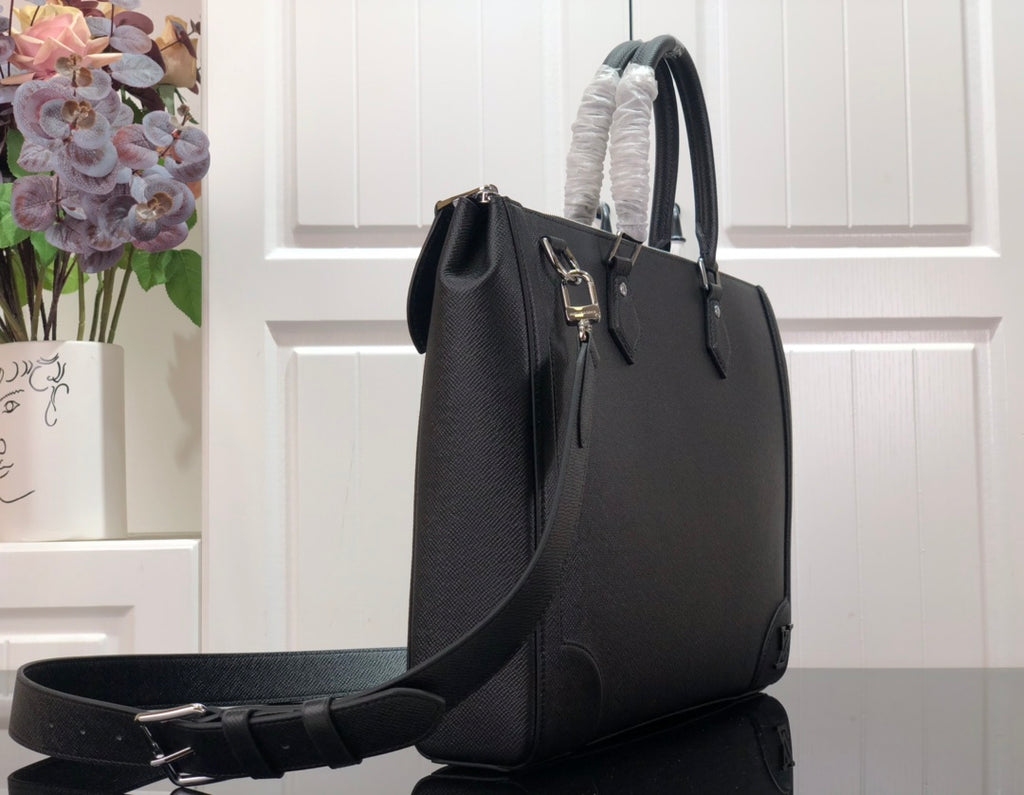 Men's Louis Vuitton structured tote bag with shoulder strap and metal buckles
