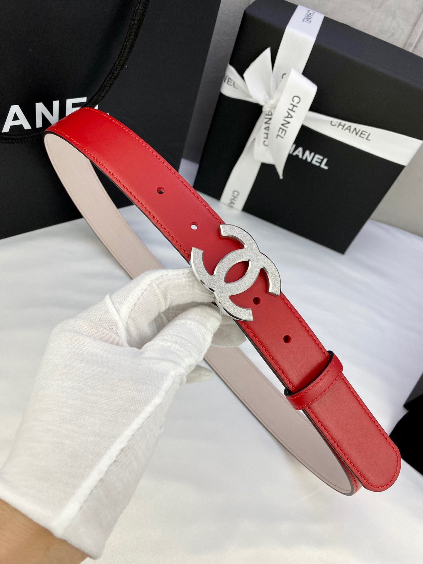 Chanel red leather belt with silver-tone CC buckle and stitched holes
