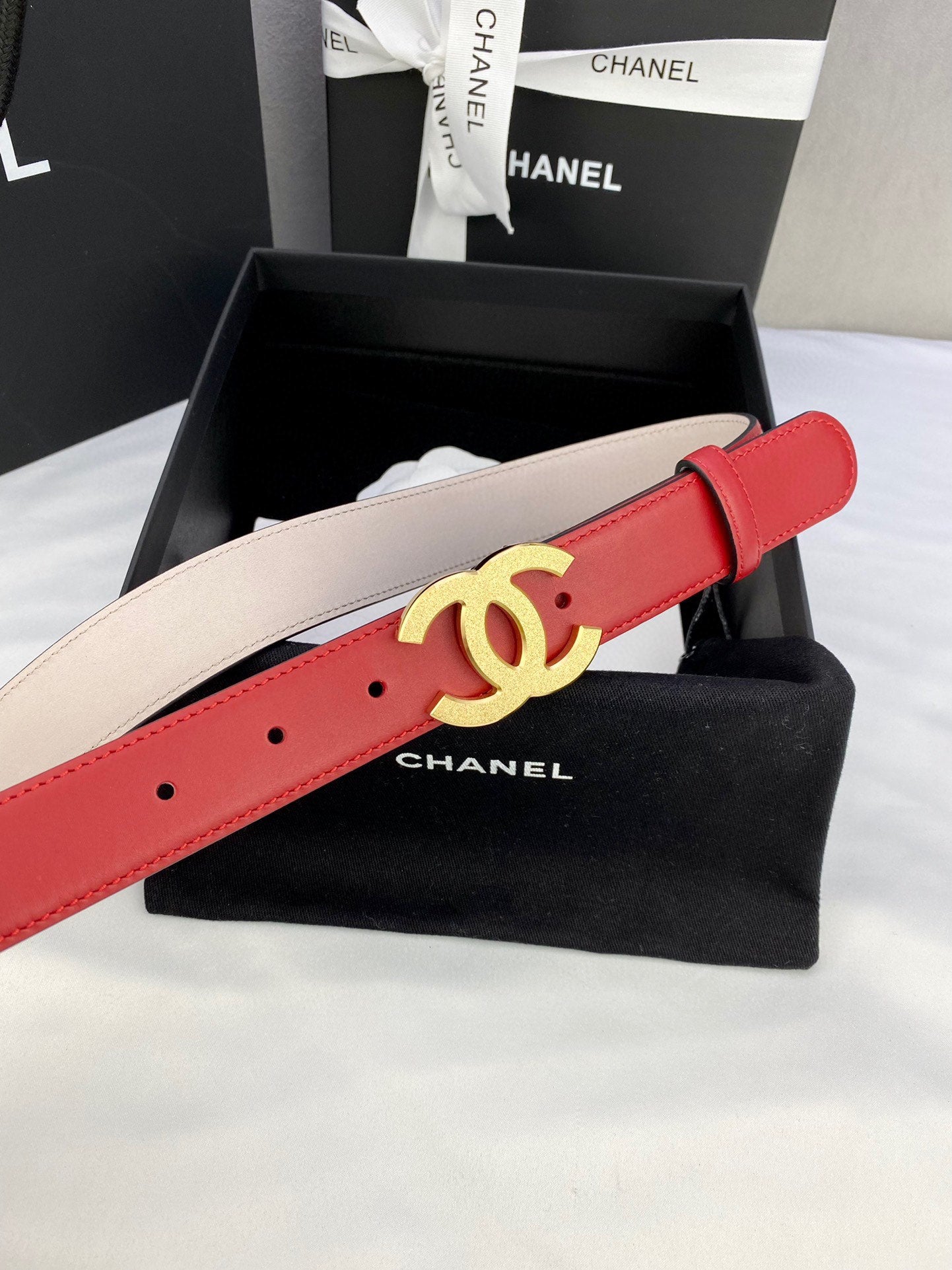 Chanel red leather belt with large gold-tone CC buckle