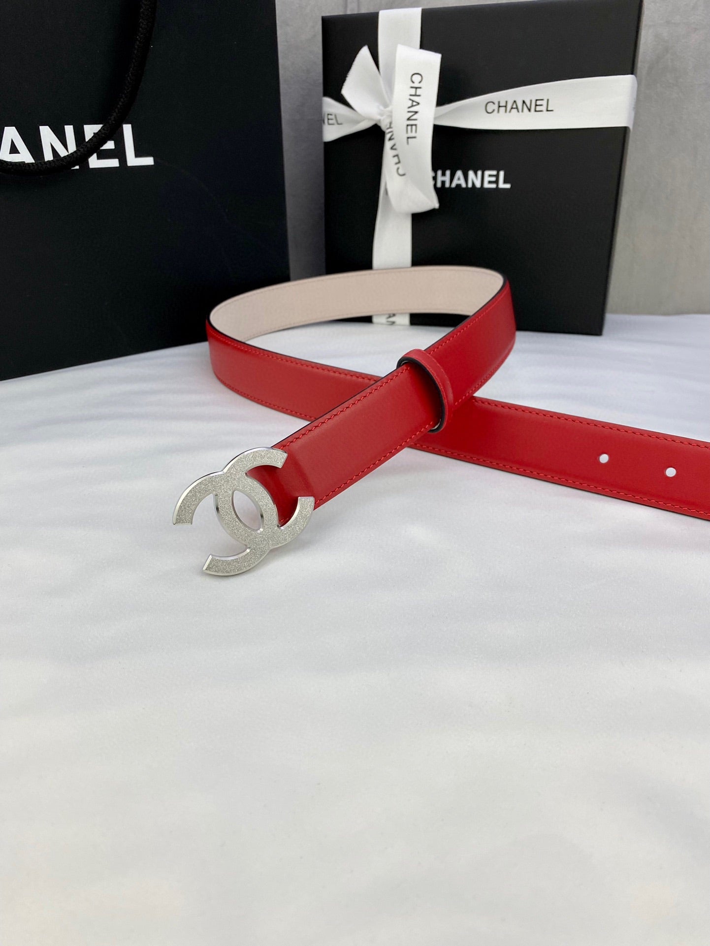 Chanel red leather belt with silver-tone CC buckle and adjustable holes