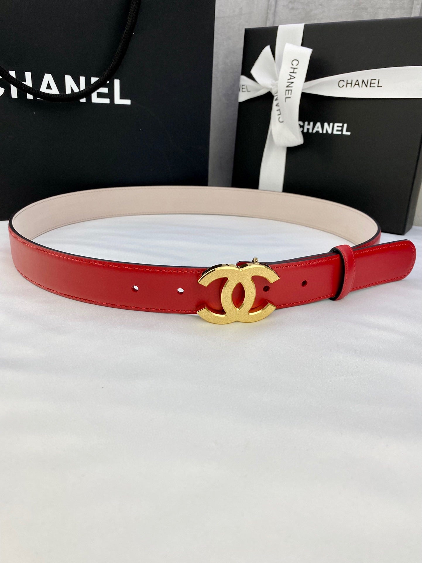 Chanel red leather belt with gold-tone CC buckle