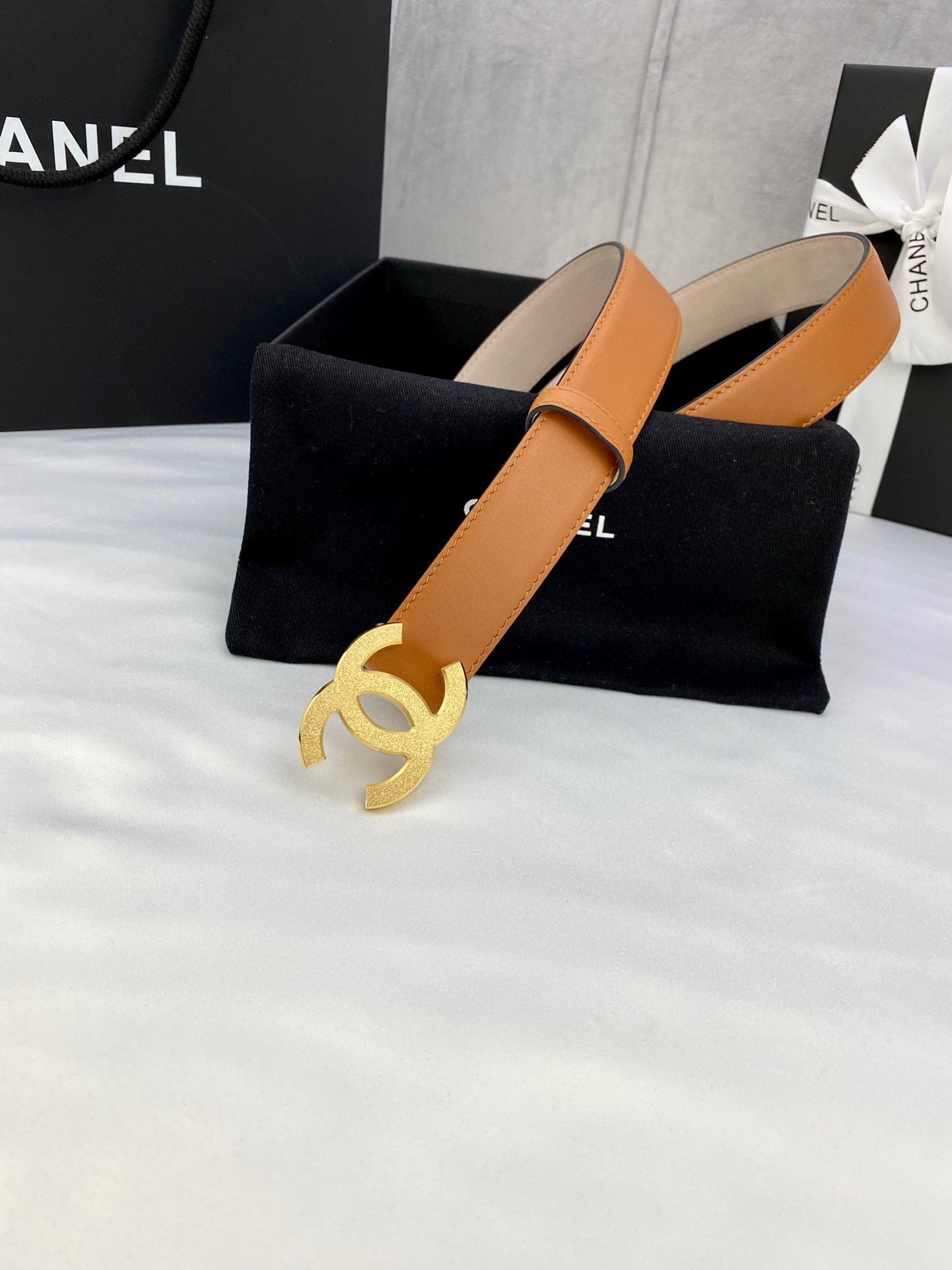 Tan leather Chanel belt with gold-tone CC buckle