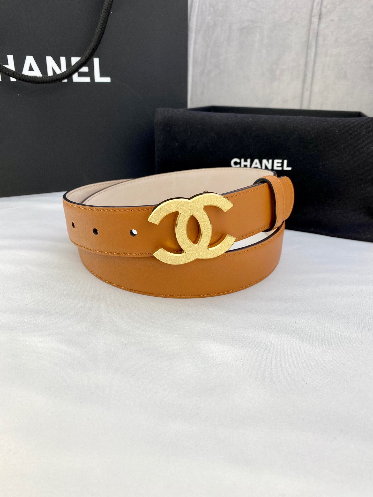 Tan leather Chanel belt with gold-tone CC logo buckle