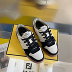 Fendi unisex sneakers, front view pair with white uppers, black laces, brown sole