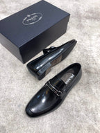 Prada unisex black leather loafers with buckle strap, heel side profile