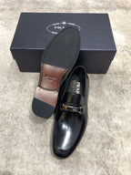 Prada unisex black leather loafer with buckle strap, sole detail