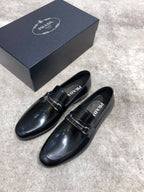 Prada unisex black leather loafers with buckle strap, side view