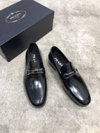Prada unisex black leather loafers, glossy finish and buckle strap