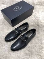 Prada unisex loafers, black leather slip-on with buckle strap, side-by-side view