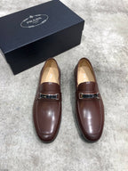 Prada unisex leather loafers, dark brown with metal buckle strap and rounded toe