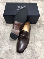 Prada unisex leather loafers, dark brown upper with buckle strap, black outsole