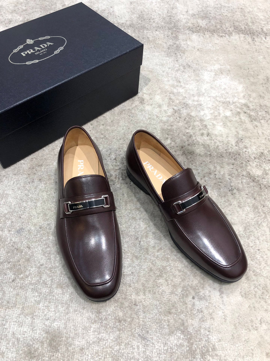 Prada unisex leather loafers, dark brown with buckle strap and almond toe