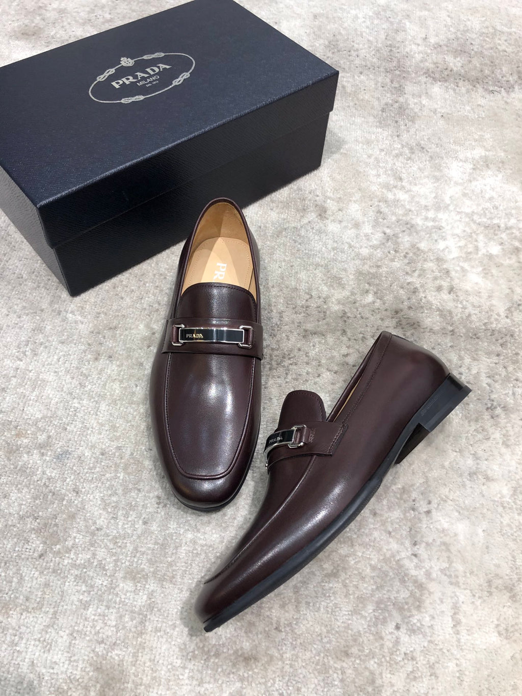 Prada unisex leather loafers, dark brown, slip-on style with buckle strap