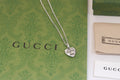 Gucci heart charm necklace with silver-tone chain and engraved heart pendant