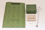 Gucci heart charm necklace with silver-tone chain and heart charm pendant