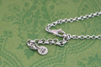 Gucci charm necklace with heart and round tag charms on silver-tone chain