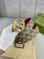 Gucci belt with beige GG monogram canvas, red leather, large gold-tone G buckle.