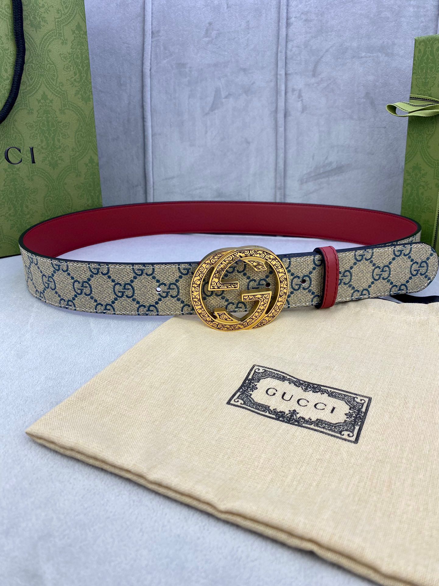 Gucci GG canvas belt with red leather lining and large gold-tone buckle