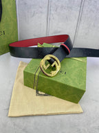 Gucci belt with navy strap, red interior, gold-tone round G buckle