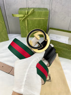 Black leather belt with oversized gold-tone GG buckle and green-red web stripe
