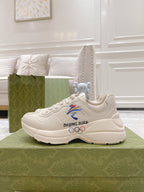 Gucci unisex white sneakers with Beijing 2022 text and colorful emblem on side
