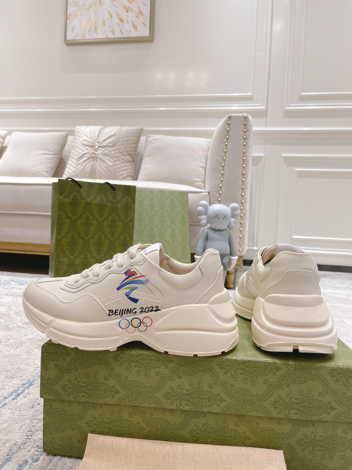 Gucci unisex white sneakers with side profile and chunky sole, paired