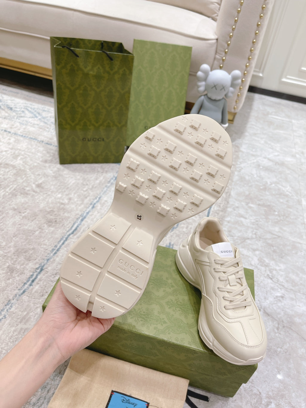 White Gucci unisex sneaker outsole with tread pattern, shoe sole close-up