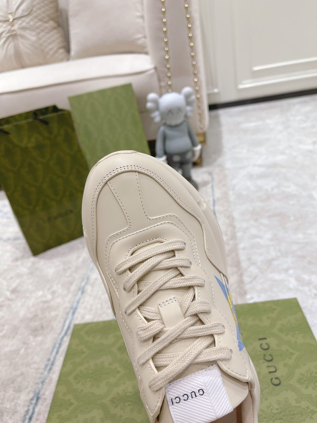 White Gucci unisex sneaker toe with lace-up, blue star GG logo detail