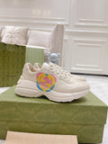 White Gucci unisex sneakers with multicolor heart GG logo, lace-up design
