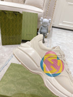 White Gucci unisex chunky sneaker with multicolor GG heart logo, side view
