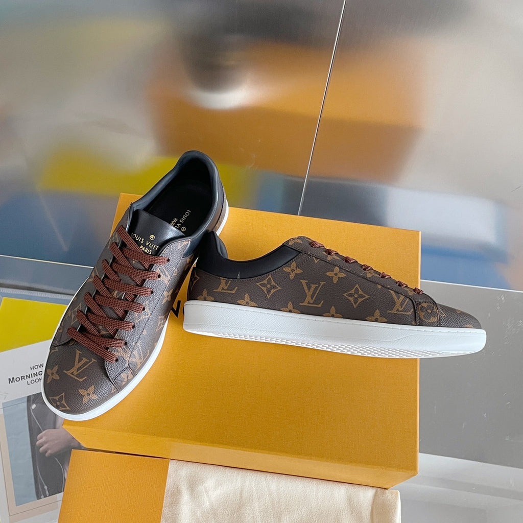 Louis Vuitton unisex sneakers, monogram canvas upper and white rubber sole.